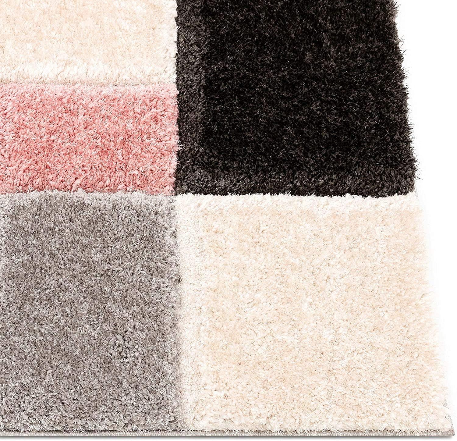 Shaggy carpet rug in pink, grey, cream, and black squares from Bhadohi Carpets House
