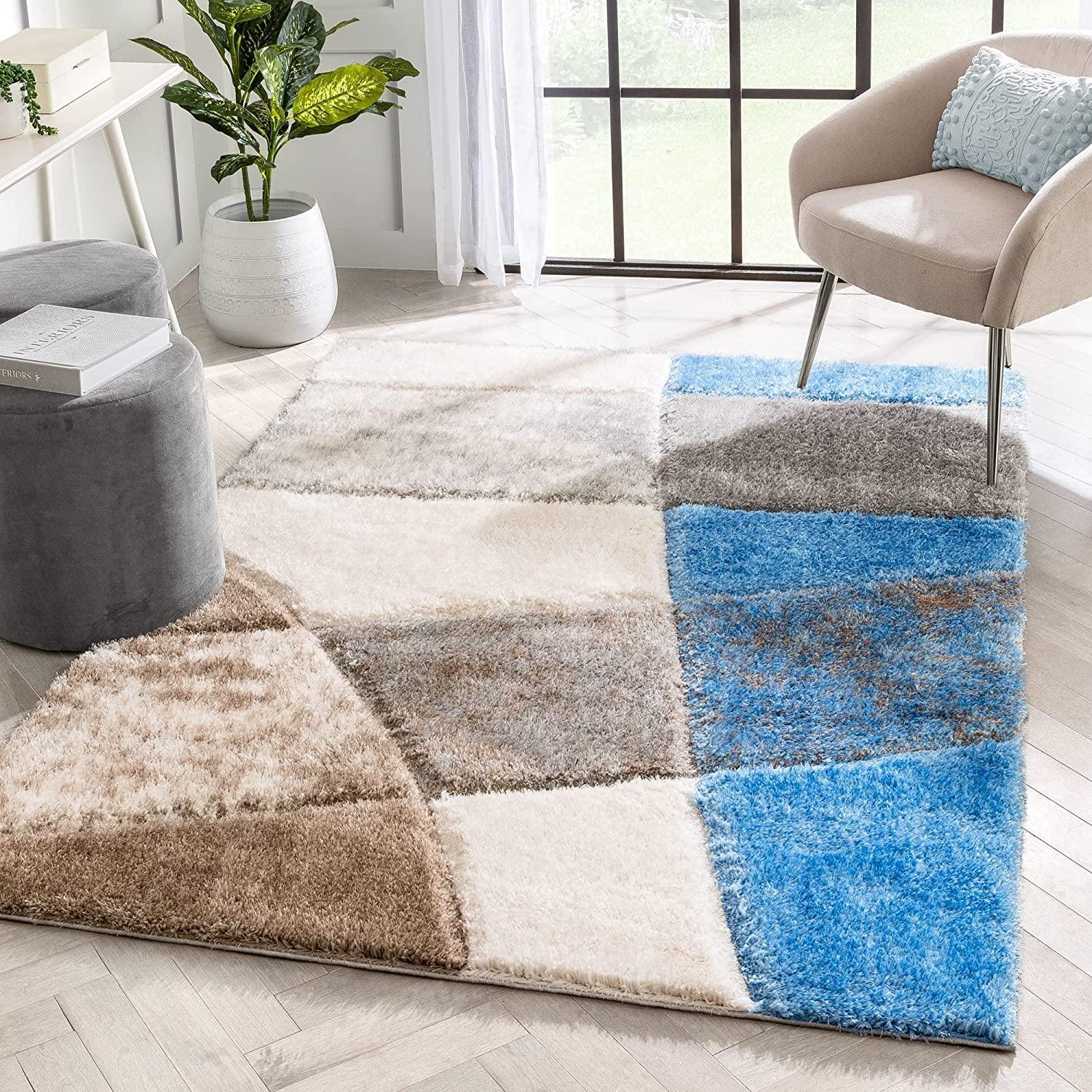 Modern shaggy carpet rug with blue, beige, and brown geometric patterns in a bright living room