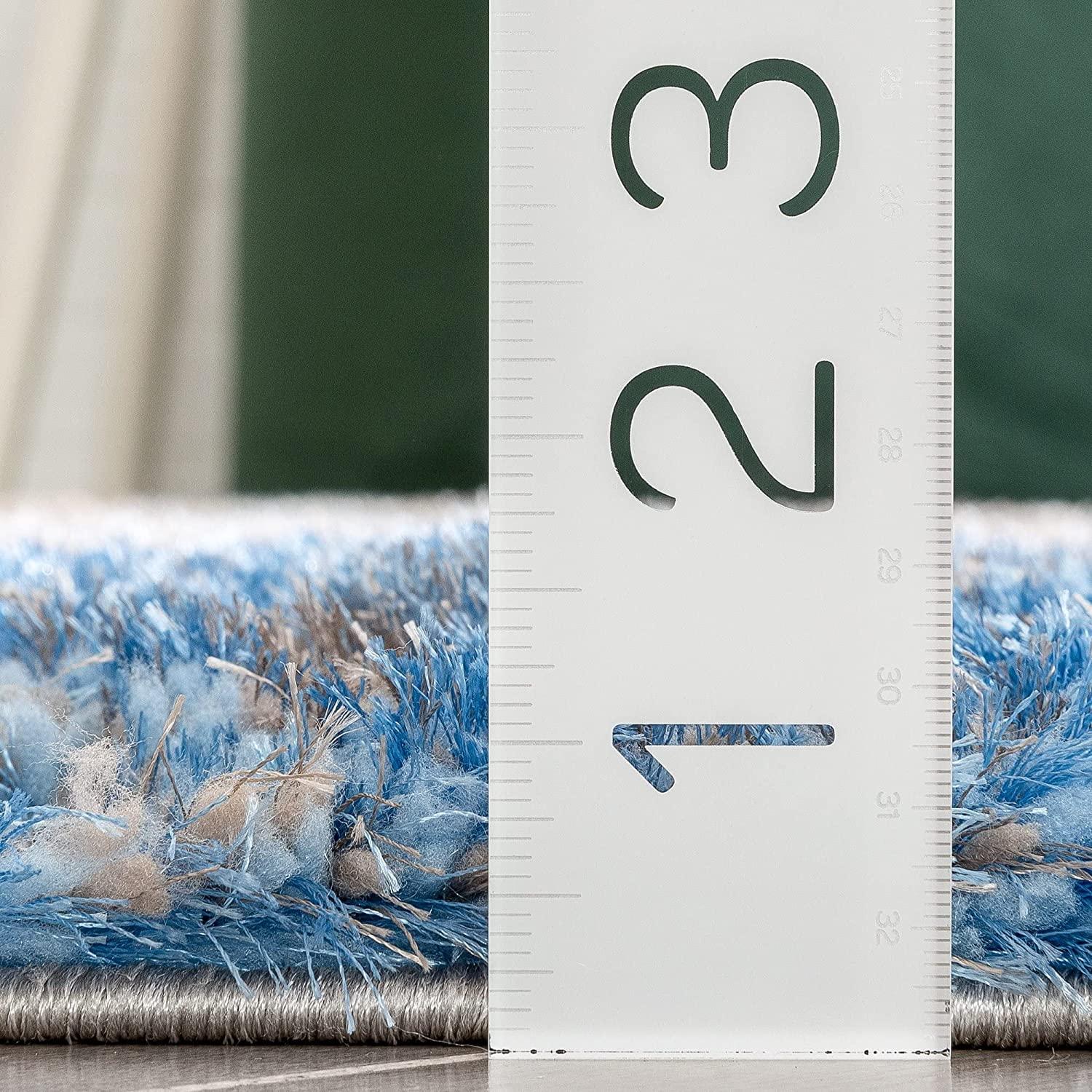 Close-up of thick blue and beige shaggy carpet with ruler, Bhadohi Carpets House rug