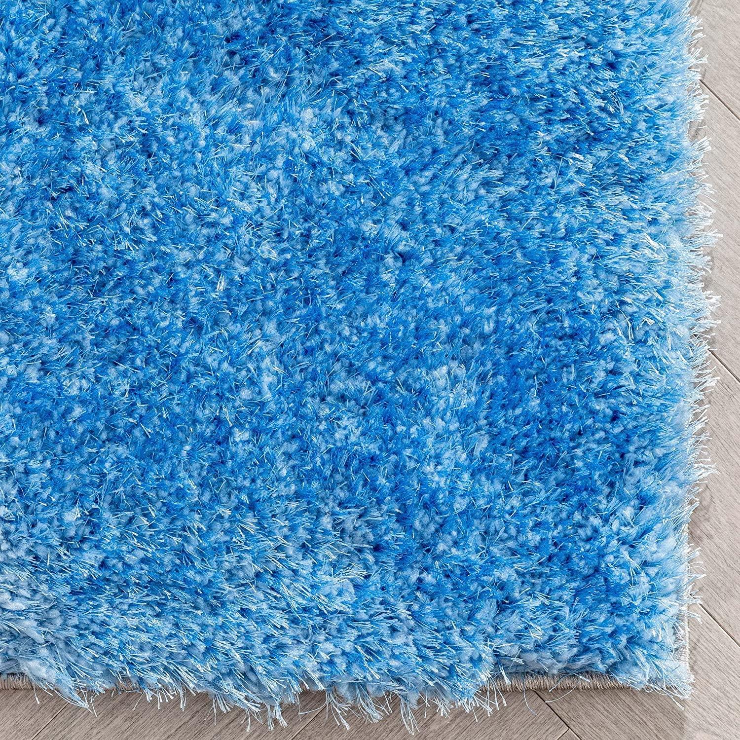 Bright blue shaggy carpet rug on light wooden floor, Bhadohi Carpets House premium decor