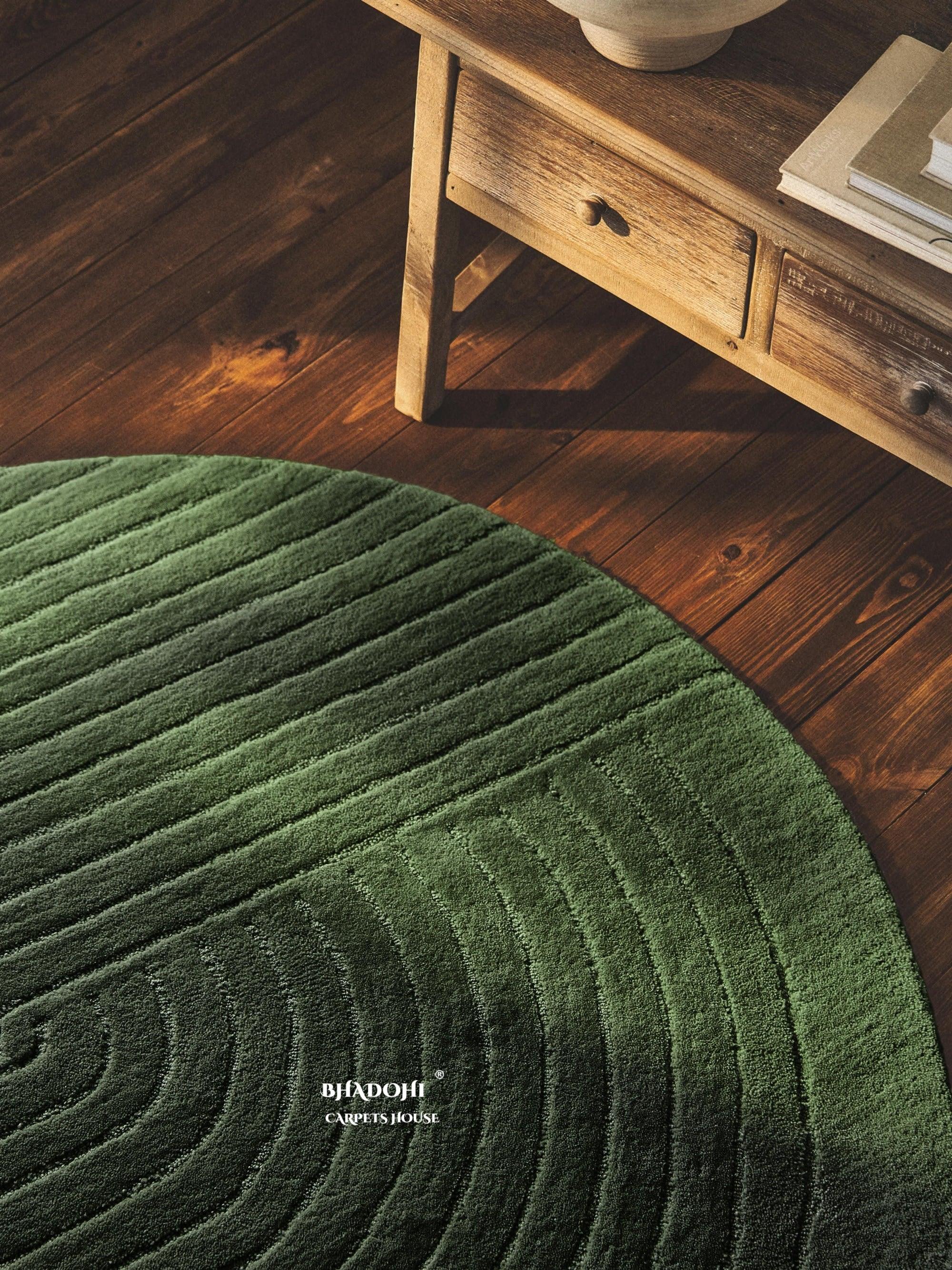 Green round wool carpet rug by Bhadohi Carpets House in a modern living room setting