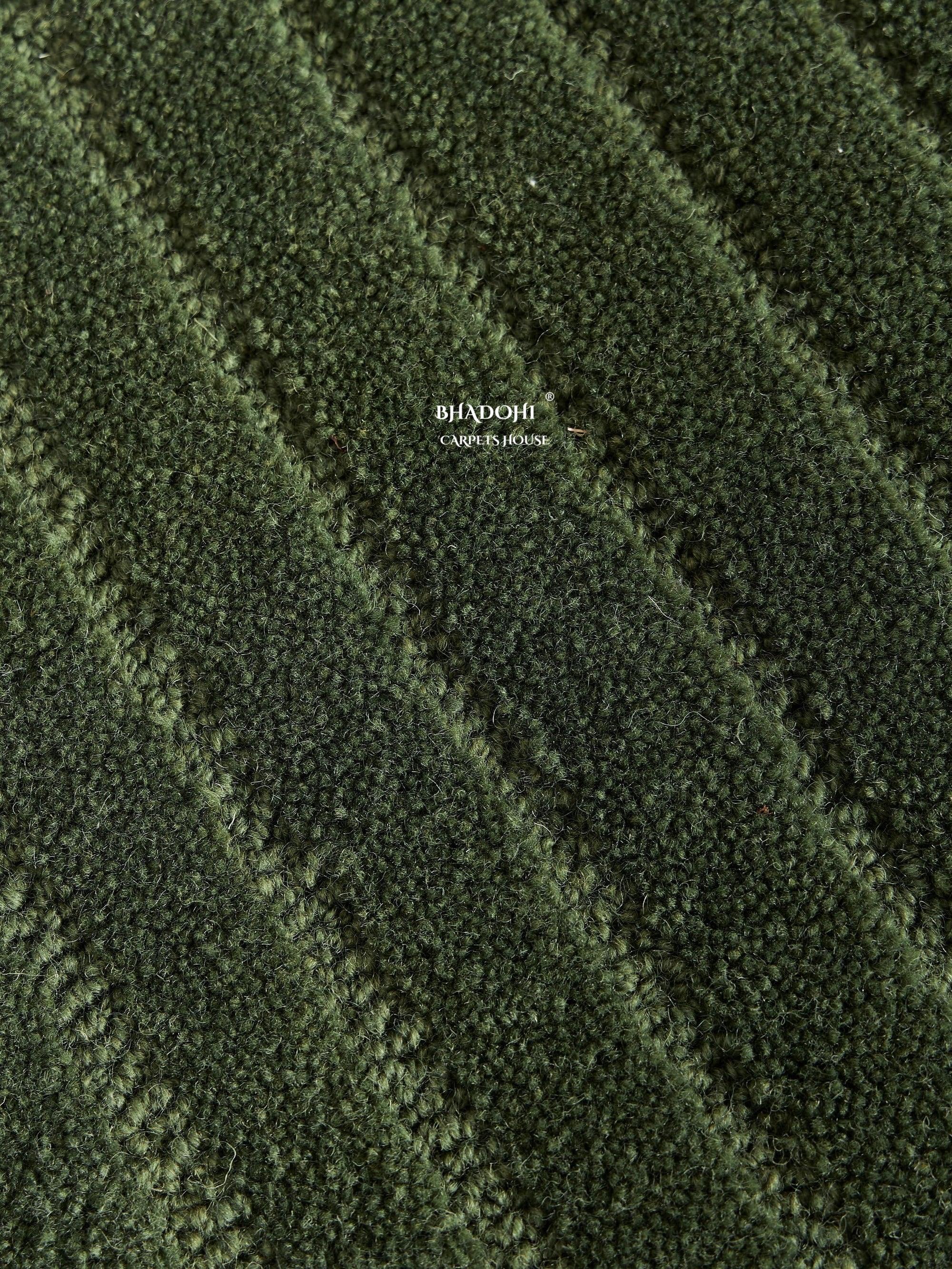 Textured green wool carpet close-up from Bhadohi Carpets House, modern India rug design