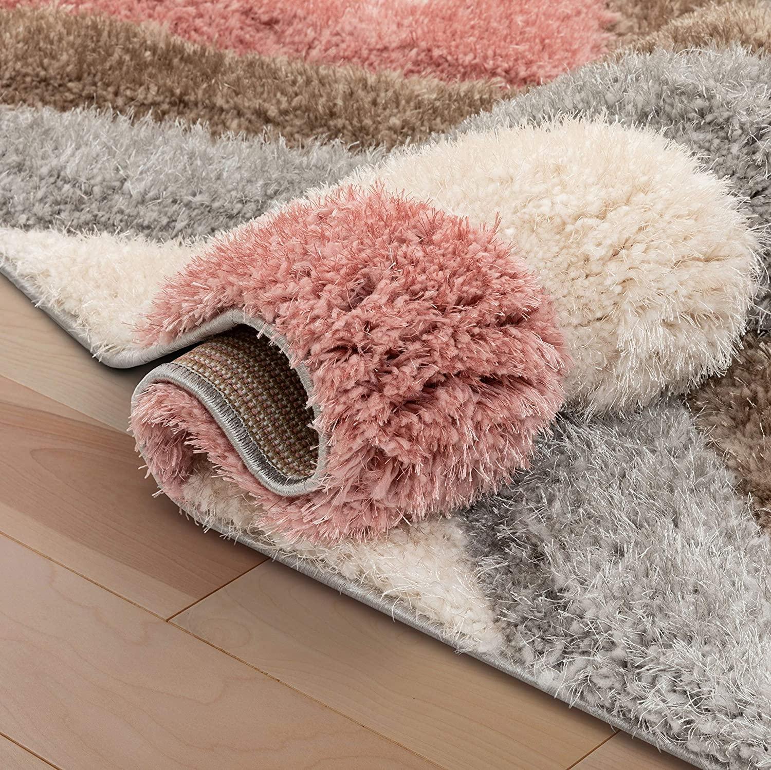 Plush shaggy carpet rug with pink, cream, grey, and brown stripes on wooden floor, Bhadohi Carpets House