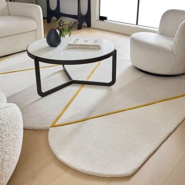 Modern living room with irregular white carpet rug, yellow accents, and minimalist furniture from Bhadohi Carpets House.