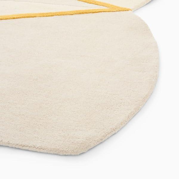 Cream irregular shaped carpet with yellow accents from Bhadohi Carpets House