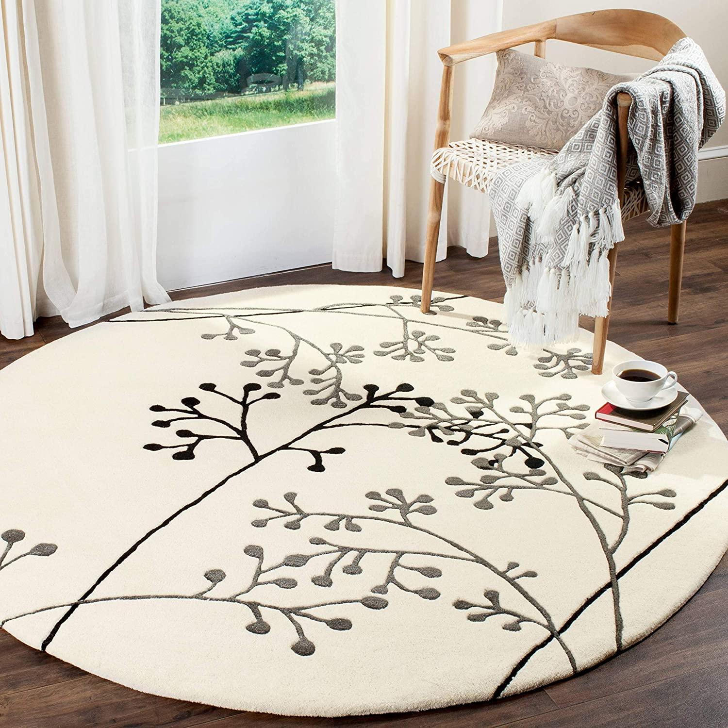 White round wool carpet with berry pattern in a modern living room, Bhadohi Carpets House